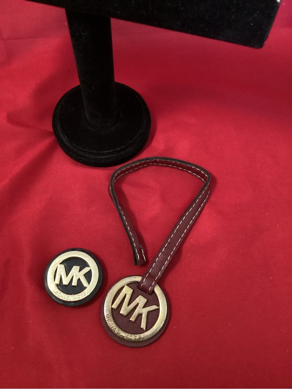 Michael Kors Burgundy Strap tag fob and Black Enamel MK brooch